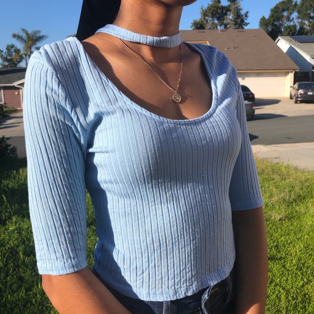 Women’s light blue top.